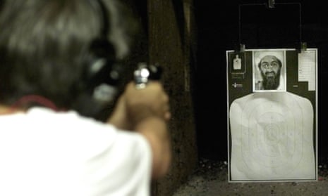 A man takes target practice using a picture of Osama bin Laden at a Dallas gun range in September, 2001.