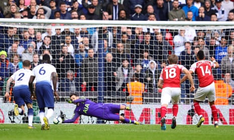 Tottenham Hotspur’s keeper Hugo Lloris saves a penalty from Arsenal’s Pierre-Emerick Aubameyang.