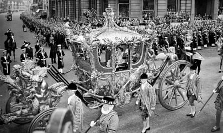 Queen Elizabeth II riding with the Duke of Edinburgh in the state coach through Trafalgar Square on the way from Buckingham Palace to Westminster Abbey for her coronation in 1953.