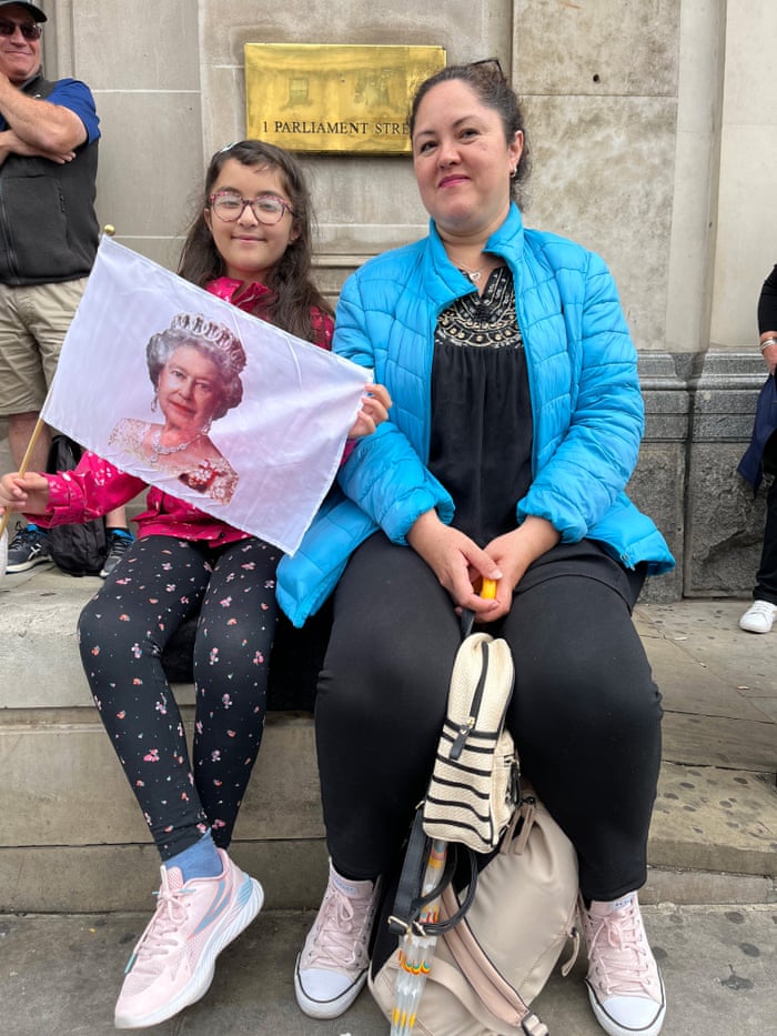 Amaya Valadez (L) and her mother Adriana Valadez wait in Westminster