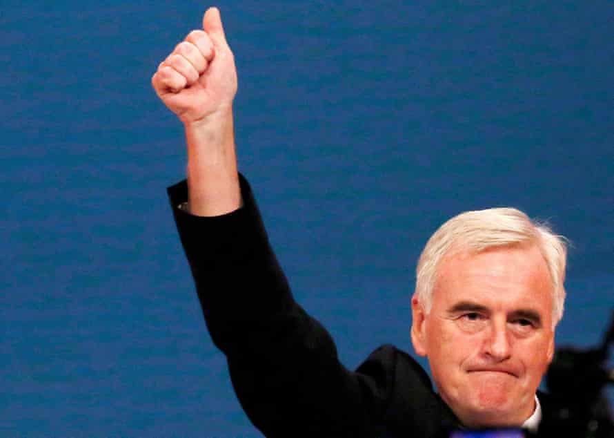 Britain’s shadow Chancellor of the exchequer John McDonnell raises his fist after speaking on stage at the annual Labour Party Conference in Brighton,