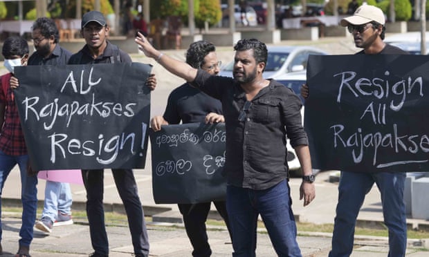 Police officers stand guard amid protests