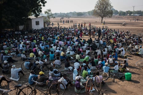 Women listen to a briefing on food distribution in the village of Malikopo, in one of the areas most affected by this year’s drought, in Chikwawa, Malawi.