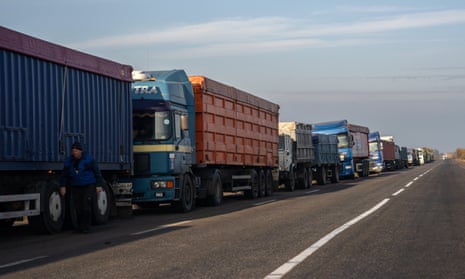 Grain trucks queue on the roadside near a port in Odesa, Ukraine.