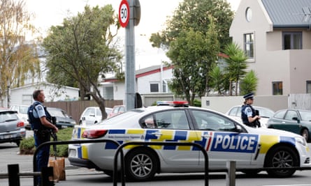 Police officers secure the area in front of Al Noor mosque after the shooting.