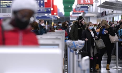 Travelers line up at O'Hare International Airport in Chicago, Illinois, on 28 December 2021. 