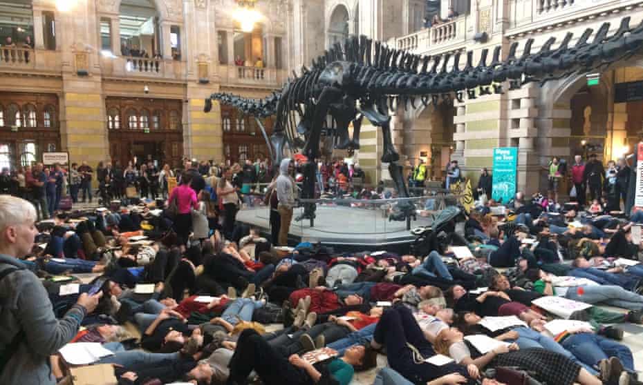 About 300 protesters lay beneath Dippy the dinosaur at Kelvingrove art gallery and museum in Glasgow. 