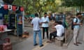A group of students sitting at an outdoor canteen at Jawaharlal Nehru University