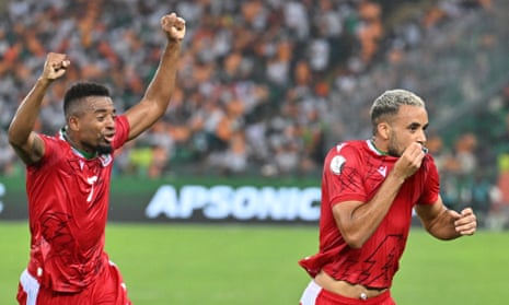 Pablo Ganet (right) celebrates after his free kick doubled Equatorial Guinea’s lead over tournament hosts Ivory Coast.