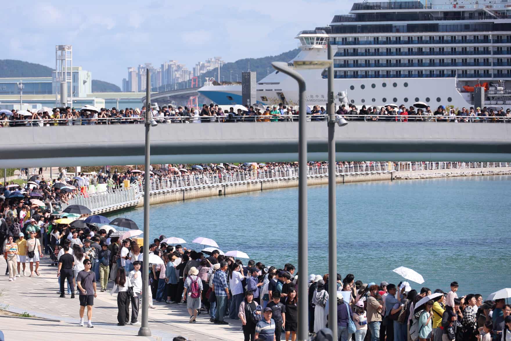 Crowds line the waterfront in Busan.