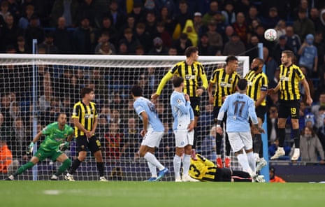 AEK Athens players in a wall jump as the attempt to block a Manchester City free-kick during a Champions League match