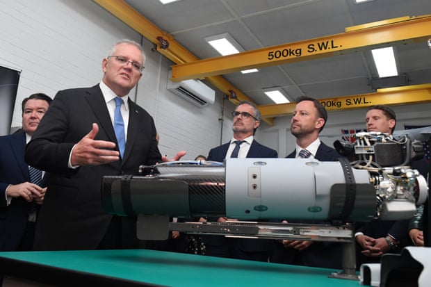 Scott Morrison with a drone engine during a visit to Orbital UAV in Western Australia. 
