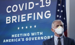 Dr Anthony Fauci wears a face mask as he arrives for the White House Covid team’s regular call with the National Governors Association on Monday.