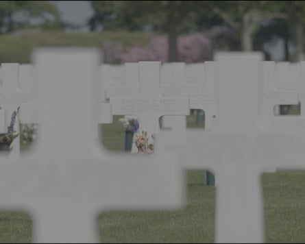 Rows of white crosses, with one in focus reading Raymond C Boyd