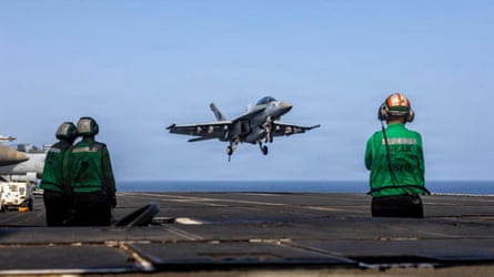 A US Navy handout photograph from May showing a US combatant landing connected USS Abraham Lincoln.