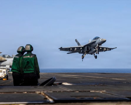 A US fighter jet landing on USS Abraham Lincoln