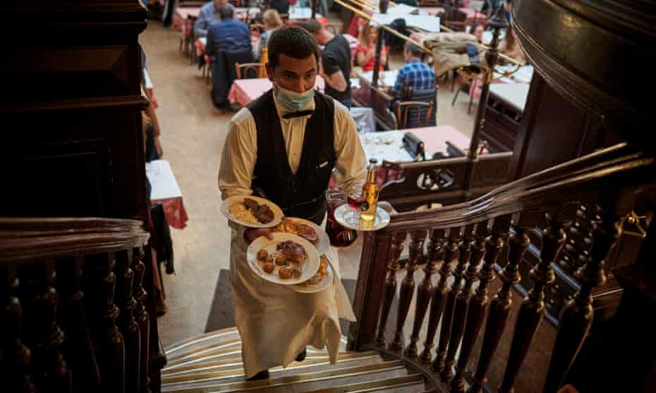 A waiter at the Chartier Bouillon restaurant near Grands Boulevards in Paris, France.