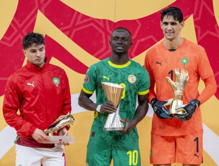 Brahim Díaz holds the Golden Boot award, Sadio Mané holds the tournament’s best player award and Yassine Bounou holds the tournament’s best goalkeeper award after the Afcon final match between Senegal and Morocco