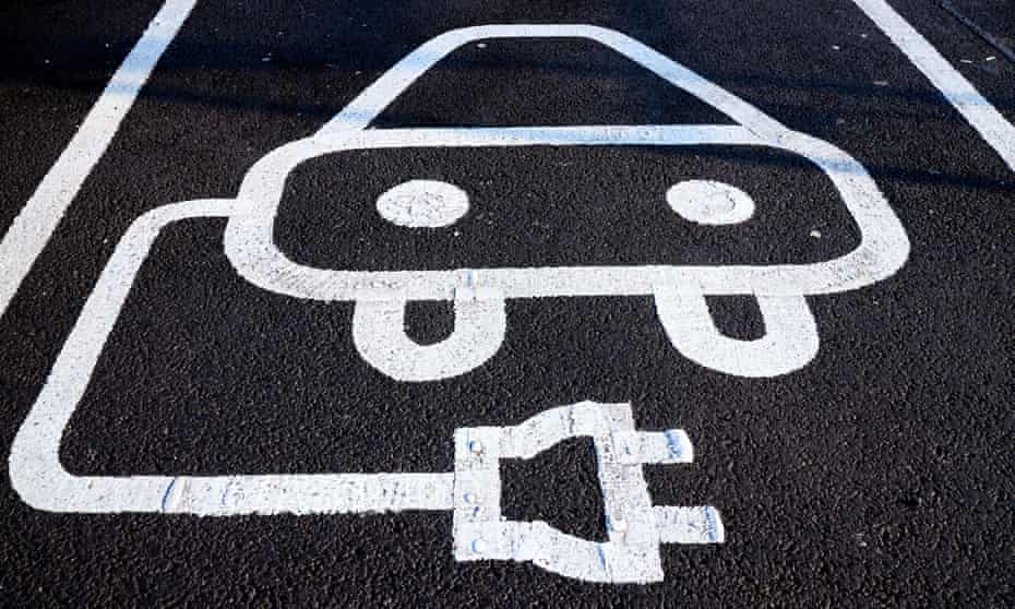 Electric vehicle parking signage on a car park space