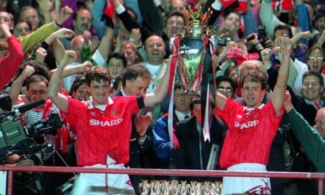 Manc3hster United’s Steve Bruce, left, and Bryon Robson lift the new Premier league trophy at the end of the inaugural 1992-1903 season.