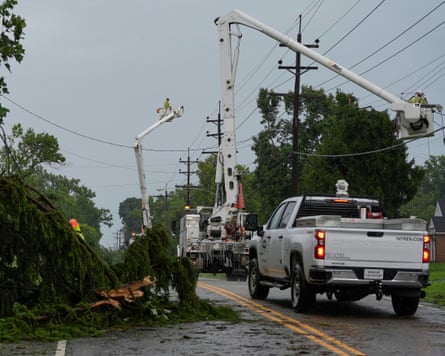 Crews raise cranes from vehicles to reach power lines