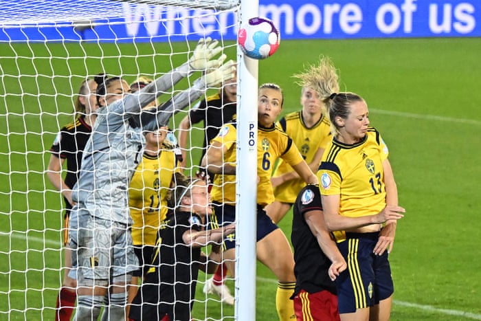 Belgium’s goalkeeper Nicky Evrard and her team-mates defend a corner which goes into the side netting .