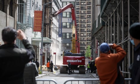 Emergency workers and members of FDNY work at the scene of a building collapse in New York City on 19 April 2023. 