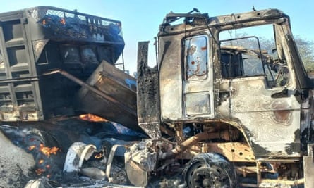A burnt out, destroyed truck
