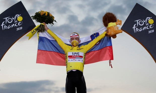 Tadej Pogacar celebrates on the podium after winning the 2020 Tour de France.