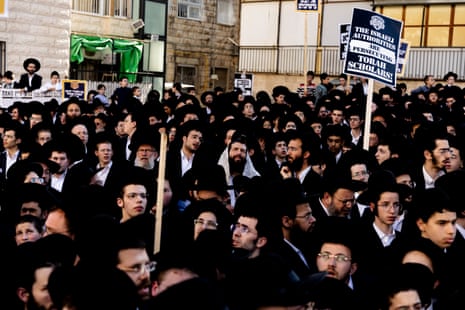 Ultra-orthodox Jews pray during a demonstration against drafting to the IDF, on Thursday in Jerusalem.
