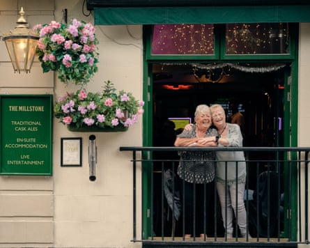 Two women in the doorway of the Millstone pub in Manchester