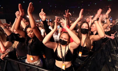 People attend a music event at Ziggo Dome venue, which opened its doors to small groups of people that have been tested negative of the coronavirus disease (COVID-19) in Amsterdam, Netherlands March 6, 2021.