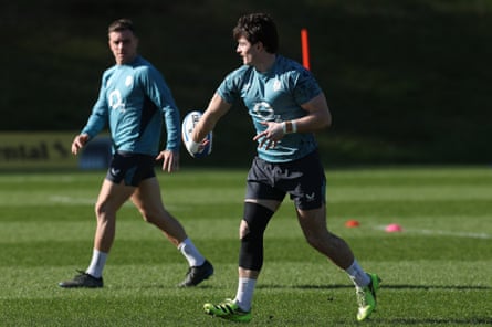 Raffi Quirke passes the ball to George Ford during an England training session at Pennyhill Park.