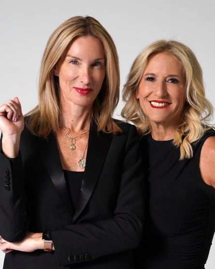 two women with blonde hair wearing black clothing