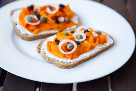 Vegan Carrot Lox - carrot-based vegan smoked salmon served on healthy sourdough bread topped with onions, capers, and vegan algae caviar
