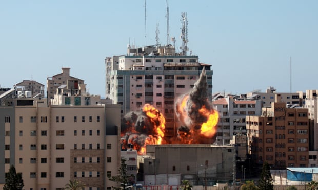 An Israeli air strike hits al-Jalaa tower in Gaza on 15 May.