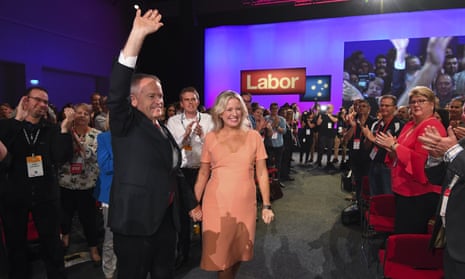 Bill Shorten and his wife, Chloe, wave at delegates as he arrives to deliver his speech at Labor party national conference.