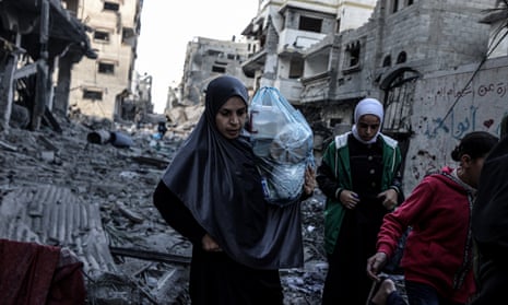 Palestinians carrying belongings flee to safer areas following Israeli bombardments on southern part of Gaza City, Tel al-Hawa neighborhood, Gaza on 16 October 2023.