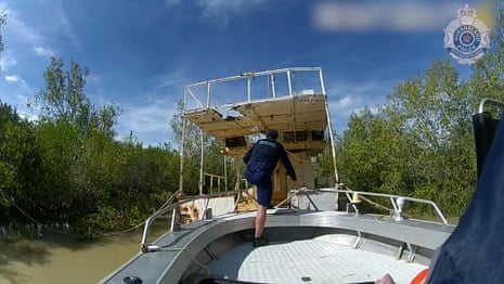 Fishing boat moves on the river against the backdrop of a tropical