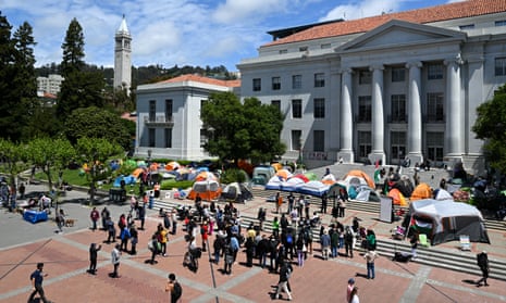 Brightly colored tents on a brick, tiered plaza.