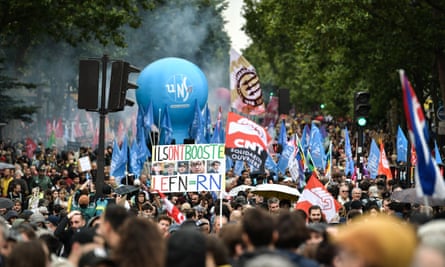Protesters participate in a demonstration against the far-right in Paris.