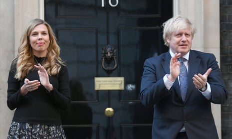 Boris Johnson and his partner Carrie Symonds, stand in Downing Street, London, to join in the Clap for Carers applause.