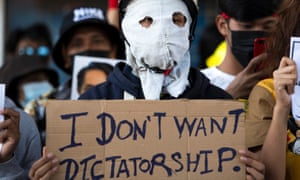 Rally against the military coup in Yangon<br>A demonstrator holds a placard during a rally against the military coup and to demand the release of elected leader Aung San Suu Kyi, in Yangon, Myanmar, February 10, 2021. REUTERS/Stringer