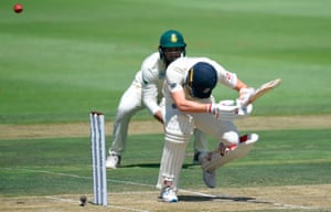 Mark Wood ducks under a bouncer during a defiant late stand with the bat.