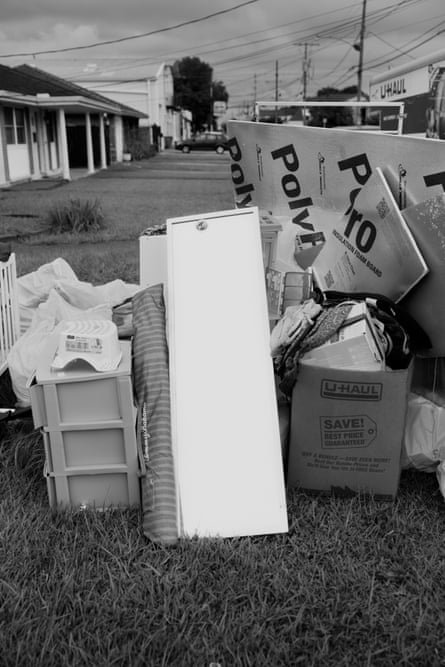Furniture and personal belongs in a heap outdoors. immersive-3-up