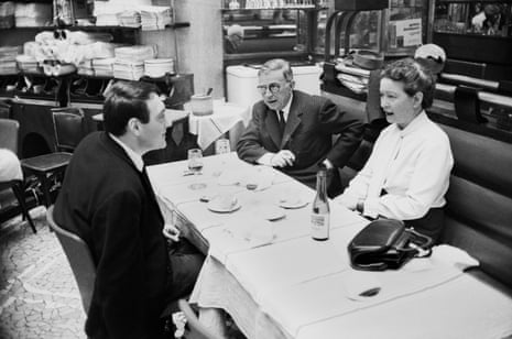 Sartre, De Beauvoir and director Claude Lanzmann dining in Paris, 1964.