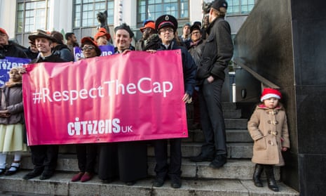 Campaigners from Citizens UK demonstrate  outside the headquarters of Wonga in London