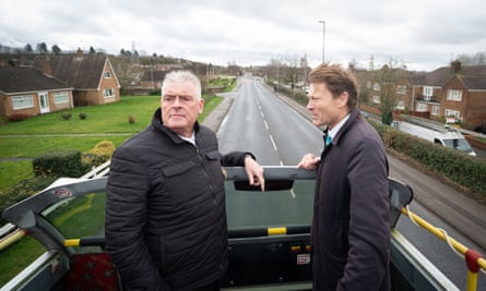 Tice and Anderson in an open-top bus.