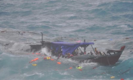 A boat smashes on the rocks off Christmas Island killing 48 people