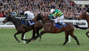 Sire Du Berlais ridden by Barry Geraghty (centre) storms up the hill to win.